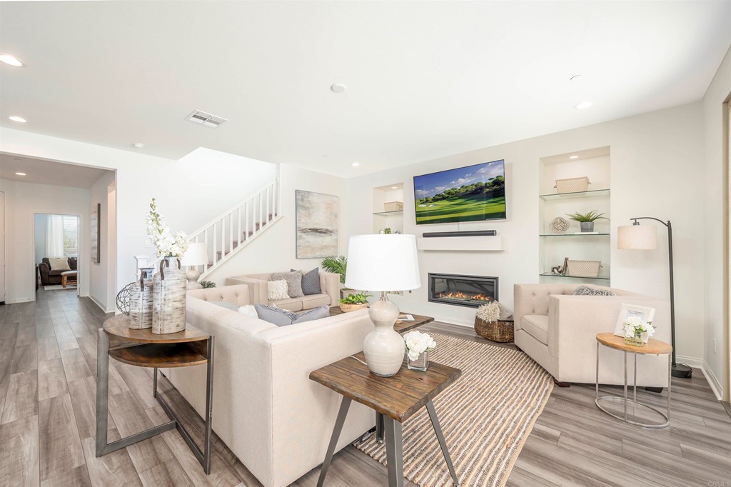33288 Skyview Road Winchester, CA 92596 - Photo 19 of 51 a living room with fireplace furniture and a flat screen tv