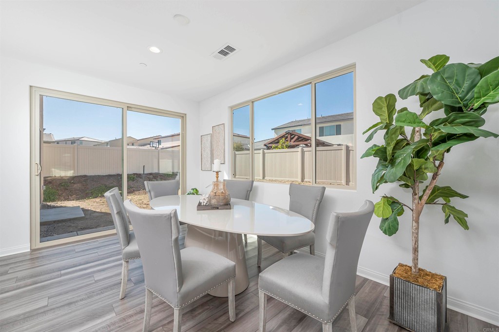 33288 Skyview Road Winchester, CA 92596 - Photo 20 of 51 a dining room with furniture potted plants and wooden floor