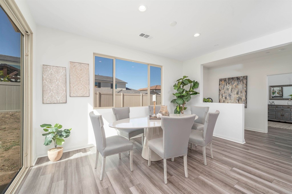 33288 Skyview Road Winchester, CA 92596 - Photo 21 of 51 a view of a dining room with furniture and wooden floor