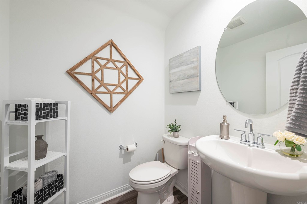 33288 Skyview Road Winchester, CA 92596 - Photo 23 of 51 a bathroom with a toilet sink and mirror