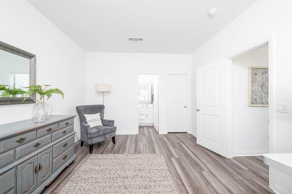 33288 Skyview Road Winchester, CA 92596 - Photo 25 of 51 a spacious bedroom with a bed and wooden floor
