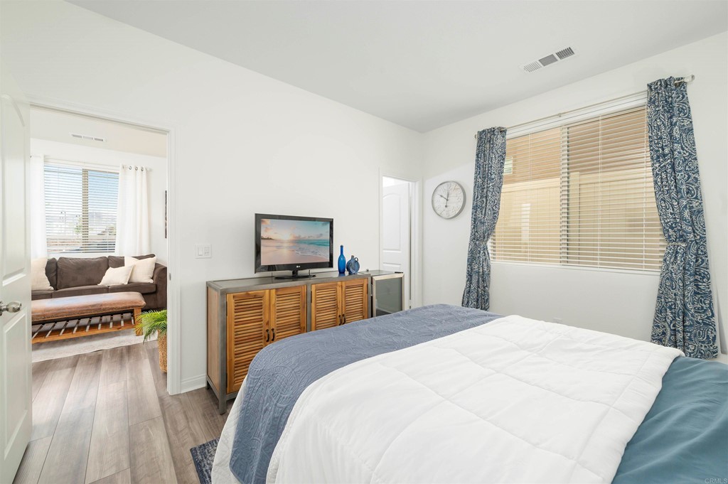 33288 Skyview Road Winchester, CA 92596 - Photo 29 of 51 a bedroom with a large bed a flat tv screen and a dresser
