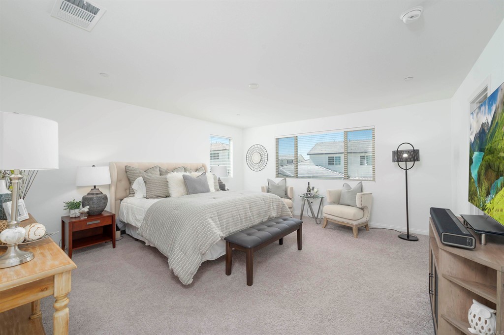 33288 Skyview Road Winchester, CA 92596 - Photo 31 of 51 a spacious bedroom with a bed and a couch