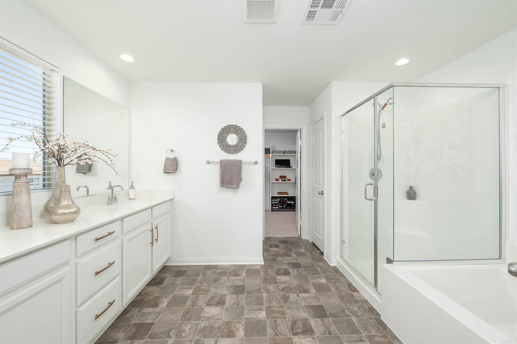 33288 Skyview Road Winchester, CA 92596 - Photo 34 of 51 a spacious bathroom with a shower sink and mirror