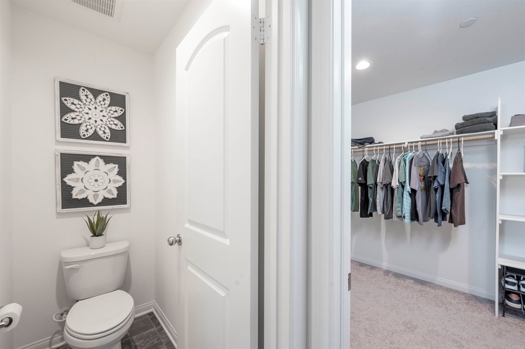 33288 Skyview Road Winchester, CA 92596 - Photo 37 of 51 a white toilet sitting next to a bathroom sink