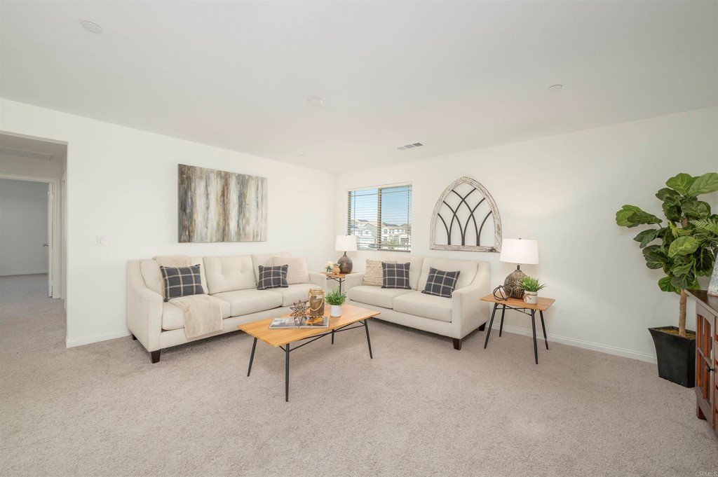 33288 Skyview Road Winchester, CA 92596 - Photo 40 of 51 a living room with furniture and a potted plant