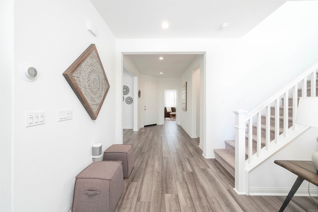 33288 Skyview Road Winchester, CA 92596 - Photo 4 of 51 a view of a hallway with wooden floor and staircase