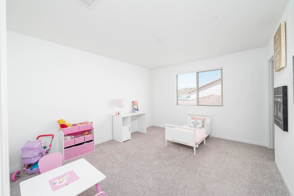33288 Skyview Road Winchester, CA 92596 - Photo 46 of 51 a living room with furniture and a baby crib