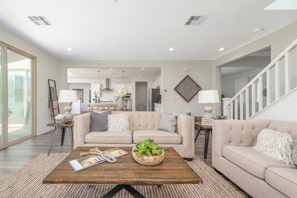 33288 Skyview Road Winchester, CA 92596 - Photo 10 of 51 a living room with furniture rug and a view of kitchen
