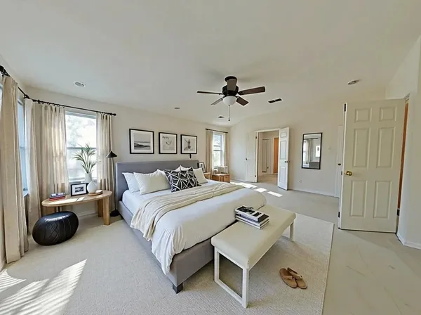 a bedroom with a bed and a couch