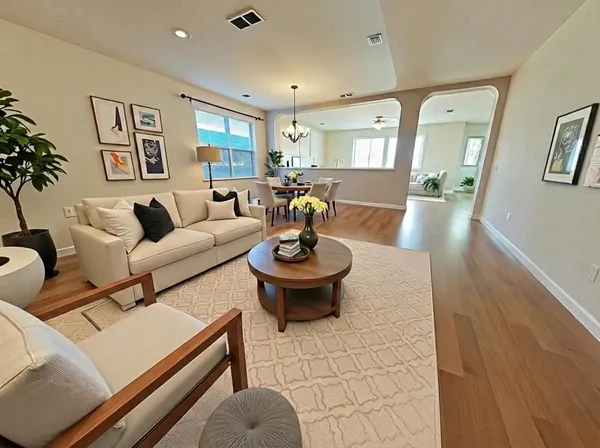 a living room with furniture and a table