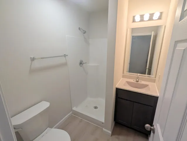 a bathroom with a sink toilet and vanity