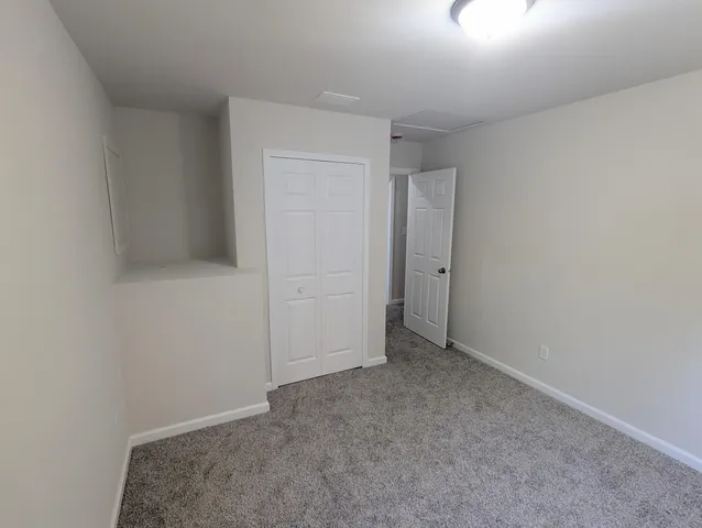 wooden floor and cabinet in an empty room