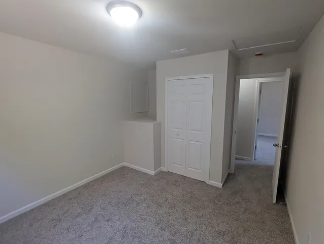 an empty room with a bench