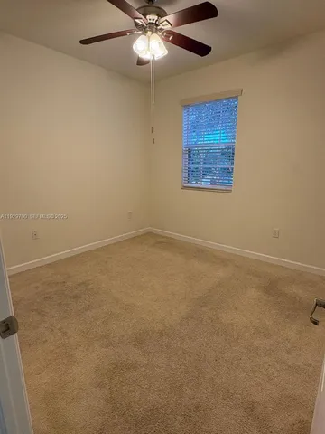a spacious bathroom with a double vanity sink a and mirror