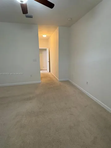 an empty room with closet area