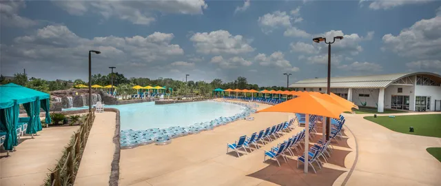 an aerial view of a house with outdoor space