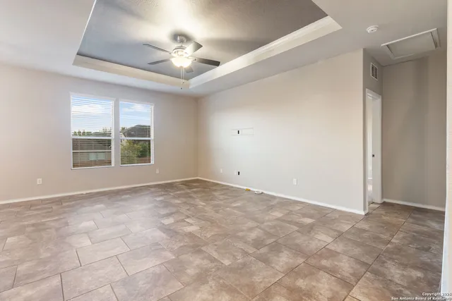 a view of an empty room with a window