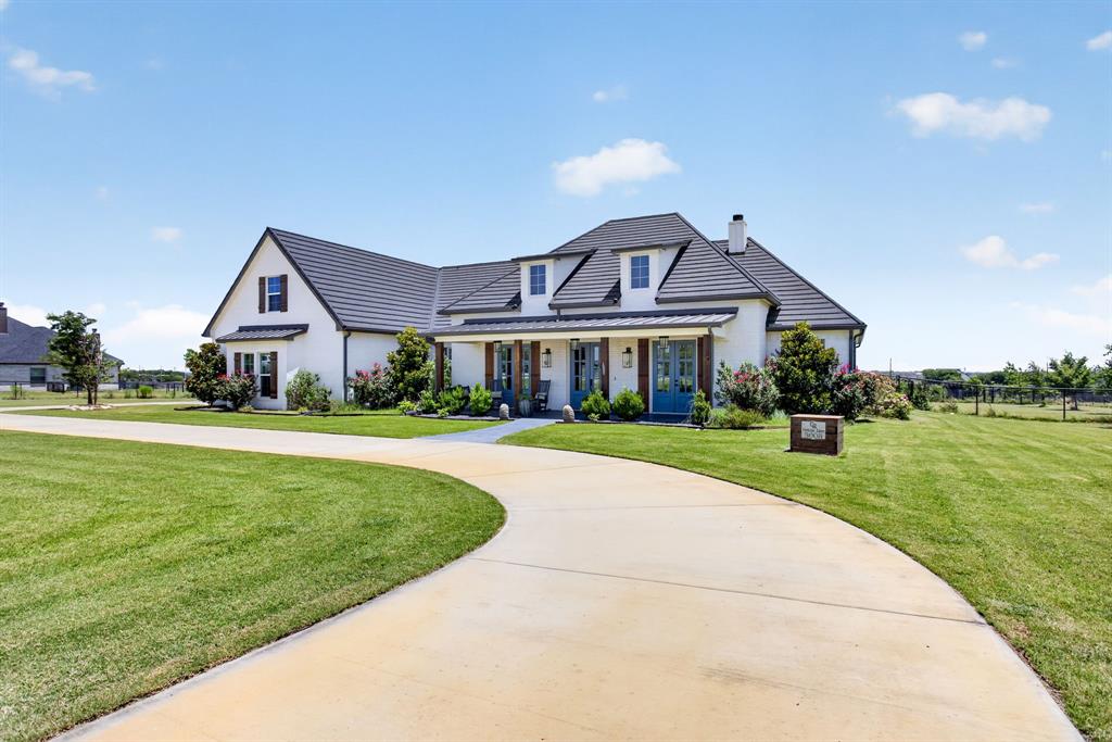 3008 Perkins Weatherford, TX 76088 - Photo 3 of 36 White stucco exterior with a dark-tiled roof
