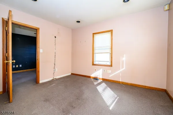 a bathroom with a sink a toilet and a window