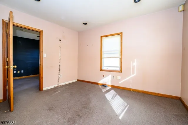 a bathroom with a sink a toilet and a window