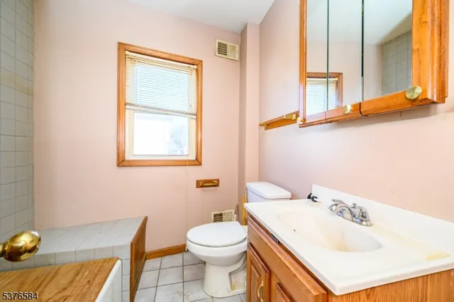 a view of staircase with white walls and a window