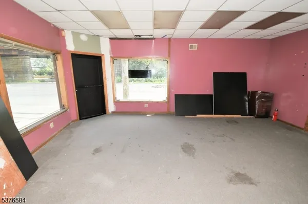 a view of empty room with windows