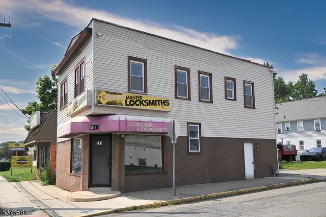 an aerial view of houses with street