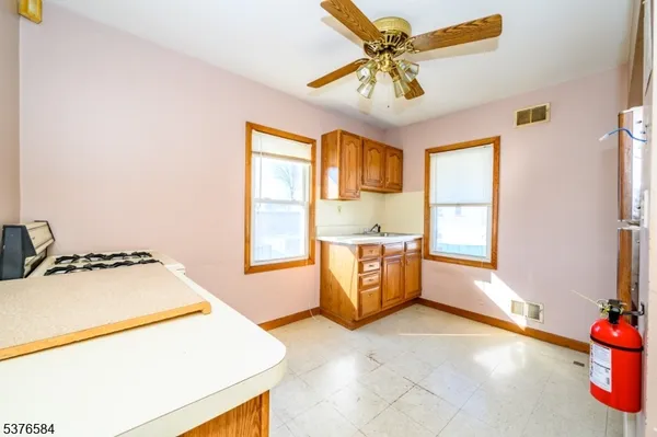 a view of a kitchen with a sink and a microwave