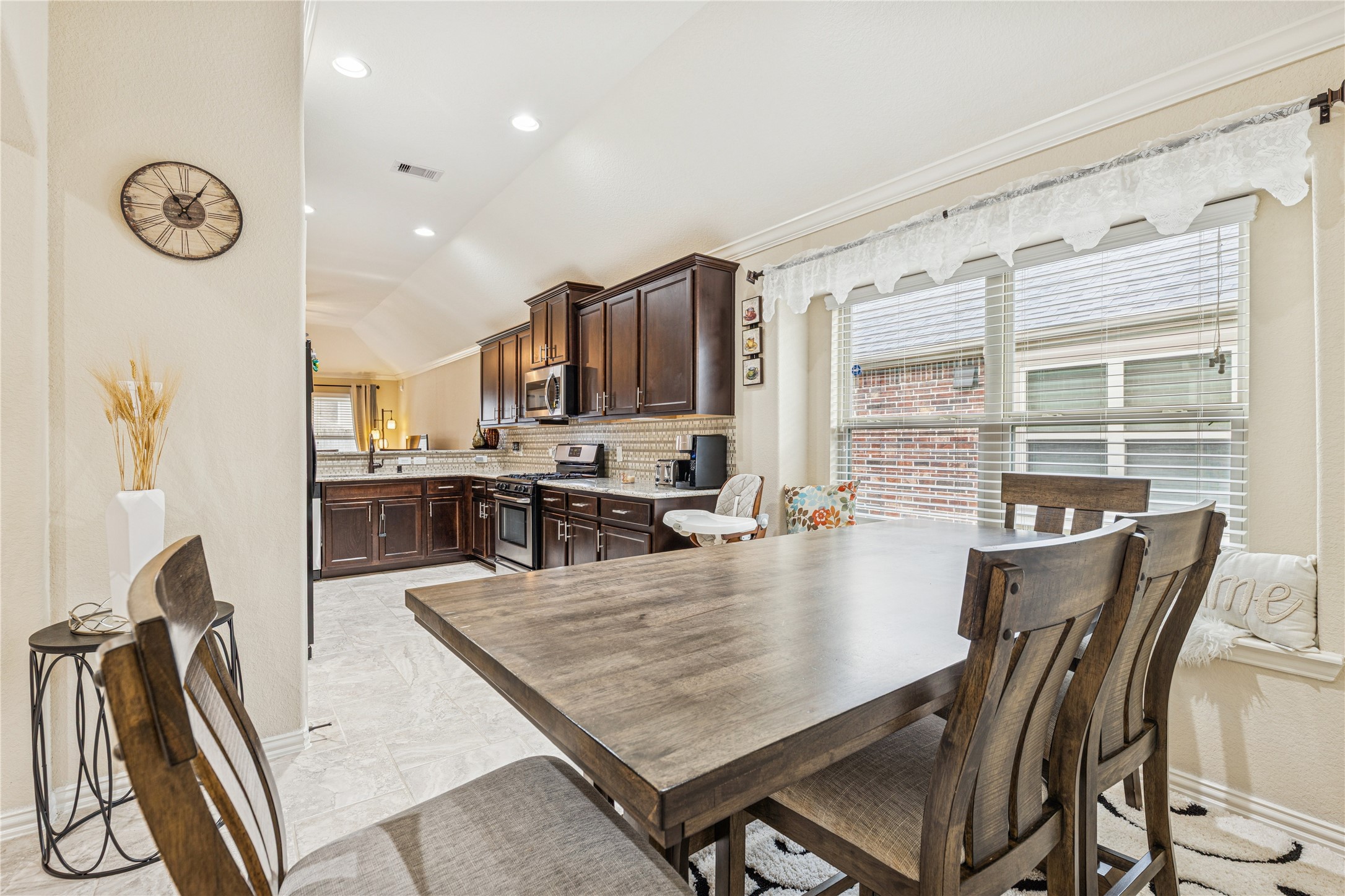 3876 Oakmist Bend Lane Spring, TX 77386 - Photo 12 of 41 a large kitchen with a table and chairs