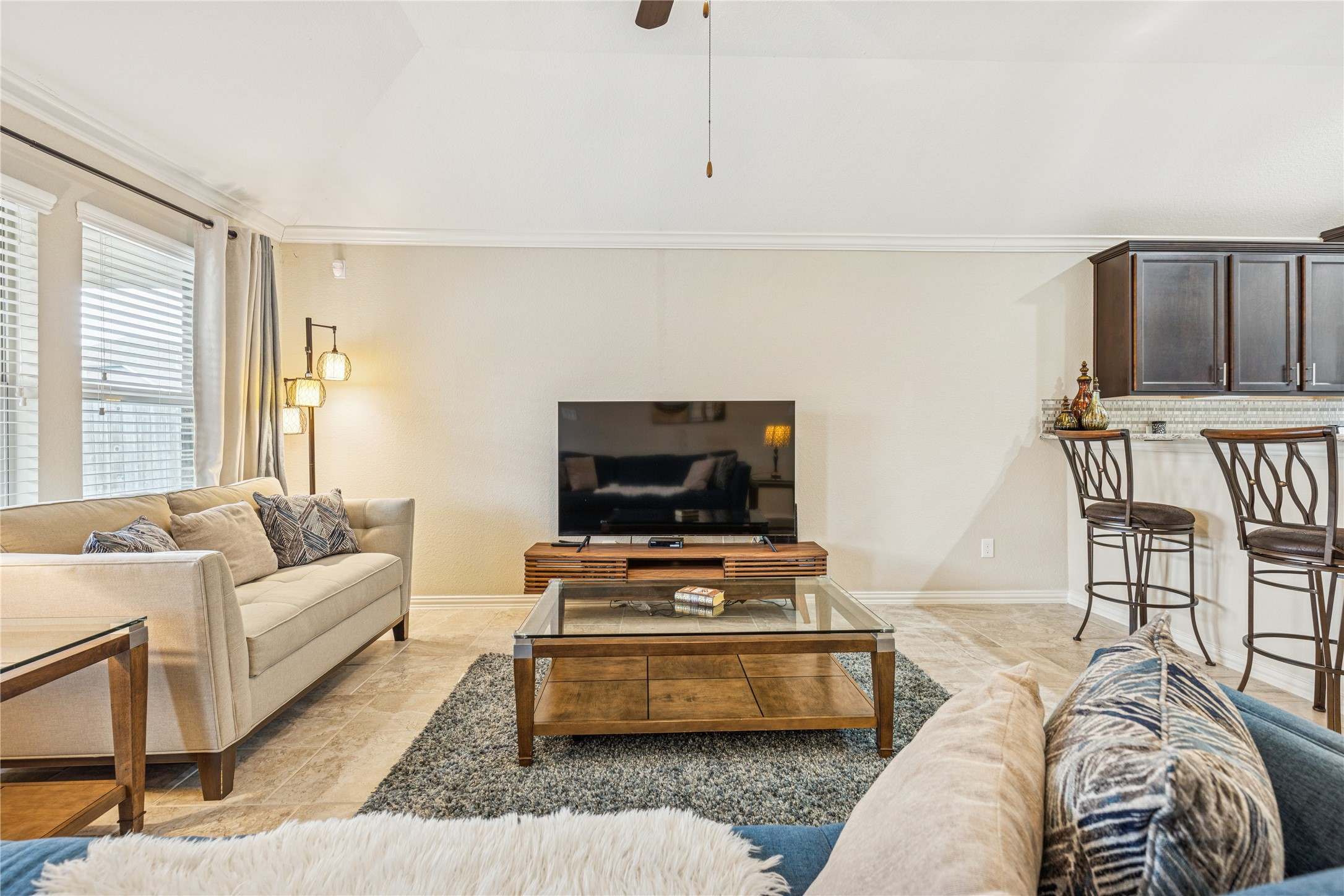 3876 Oakmist Bend Lane Spring, TX 77386 - Photo 18 of 41 a bedroom with furniture and a flat screen tv