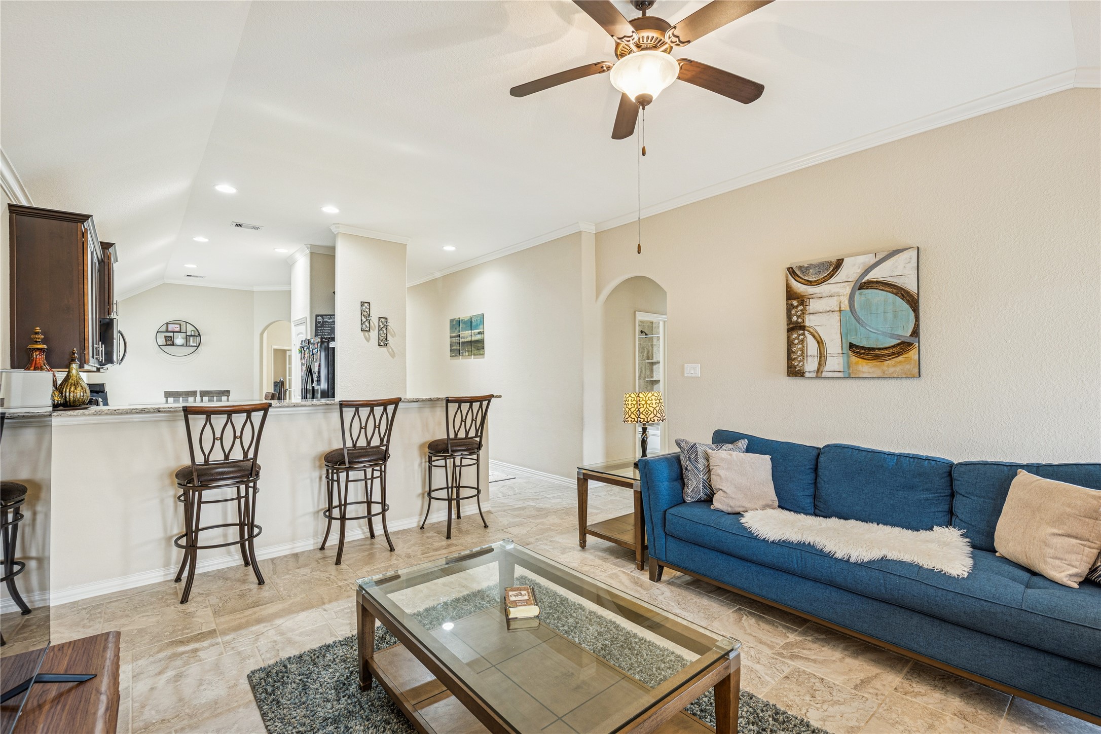 3876 Oakmist Bend Lane Spring, TX 77386 - Photo 19 of 41 a living room with furniture and a chandelier