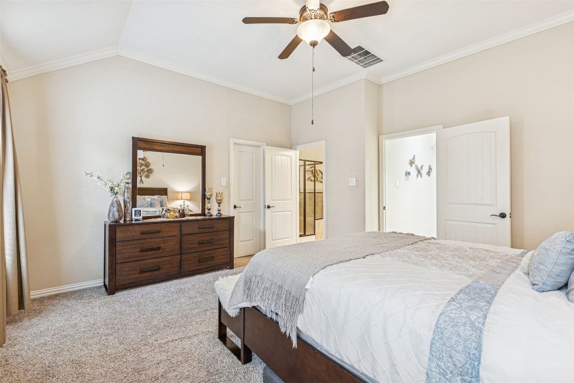 3876 Oakmist Bend Lane Spring, TX 77386 - Photo 27 of 41 a bedroom with a bed and a dresser