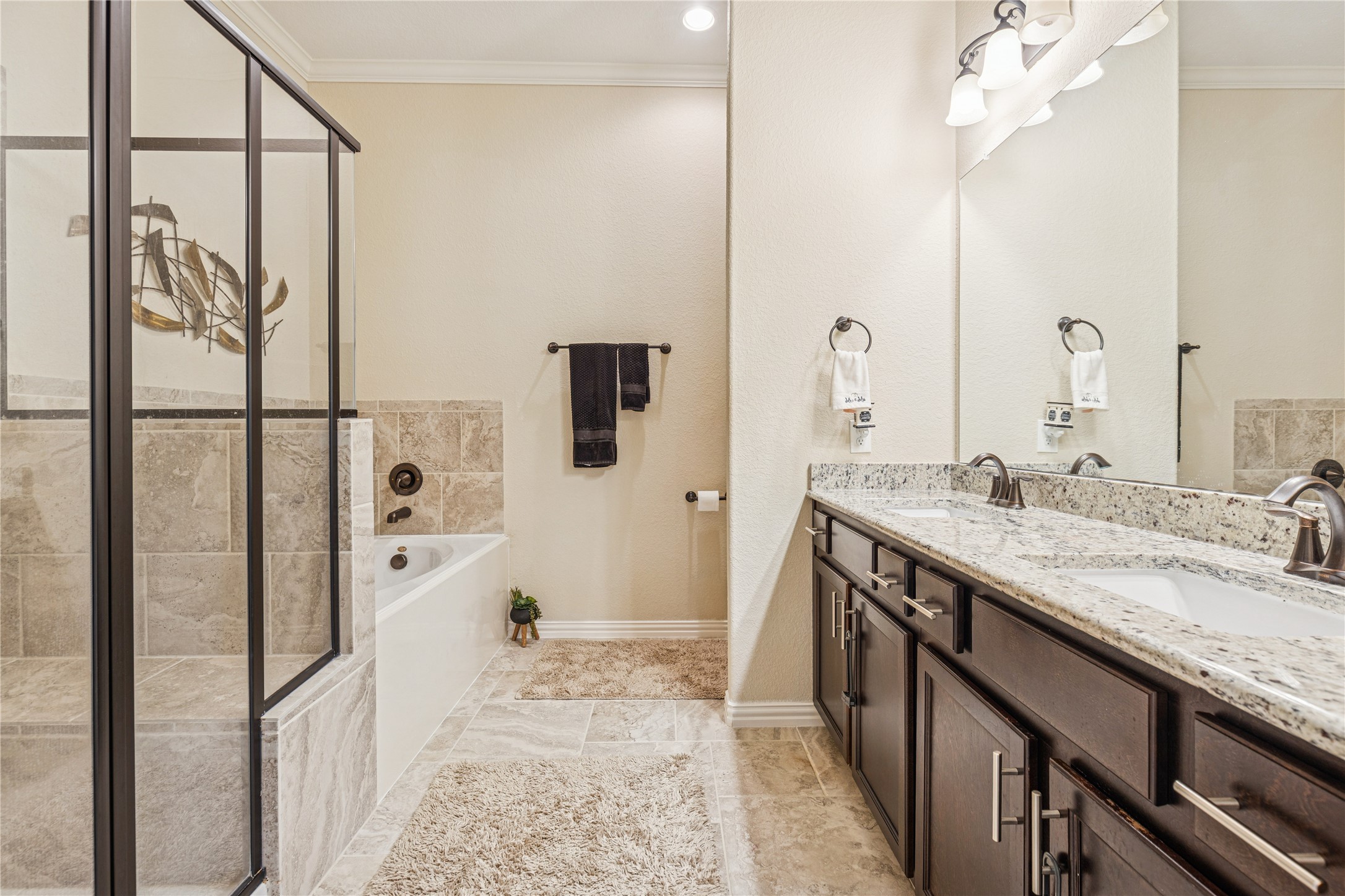 3876 Oakmist Bend Lane Spring, TX 77386 - Photo 28 of 41 a spacious bathroom with a granite countertop sink a mirror and shower