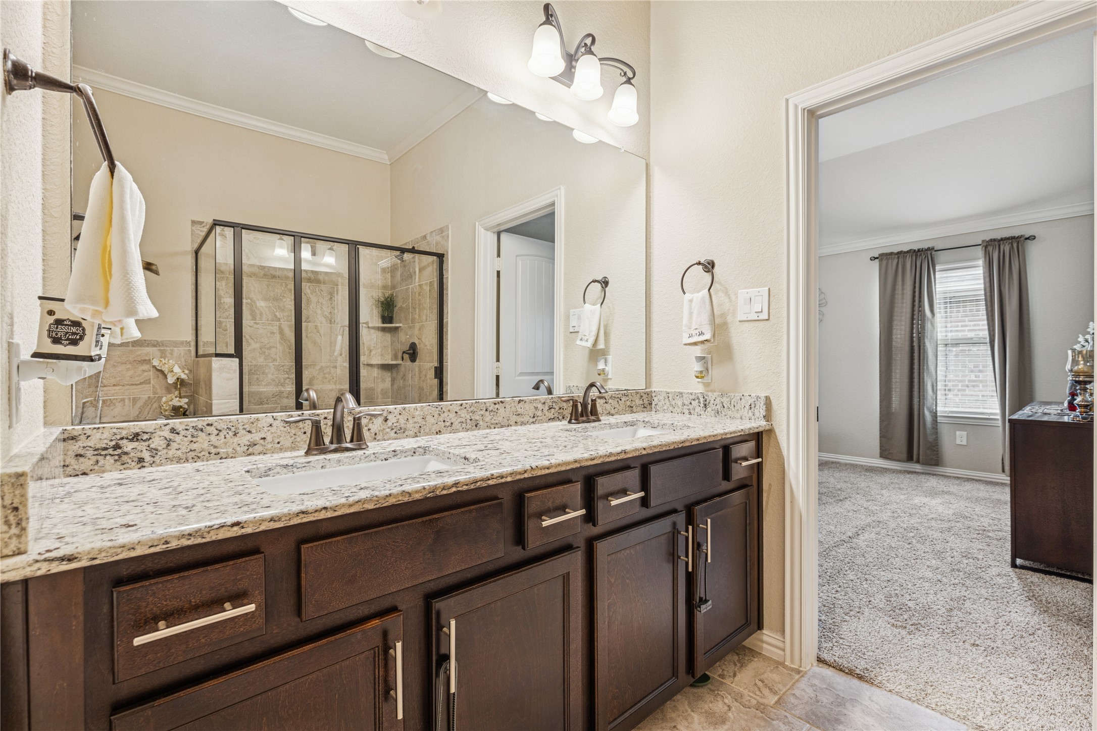 3876 Oakmist Bend Lane Spring, TX 77386 - Photo 29 of 41 a bathroom with a granite countertop sink double and mirror