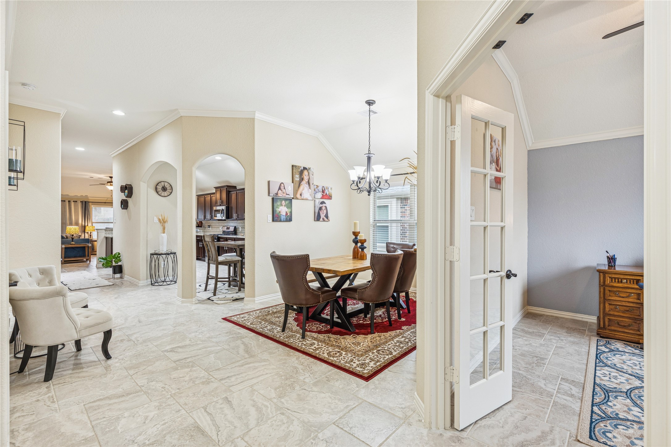 3876 Oakmist Bend Lane Spring, TX 77386 - Photo 3 of 41 a living room with furniture and a chandelier