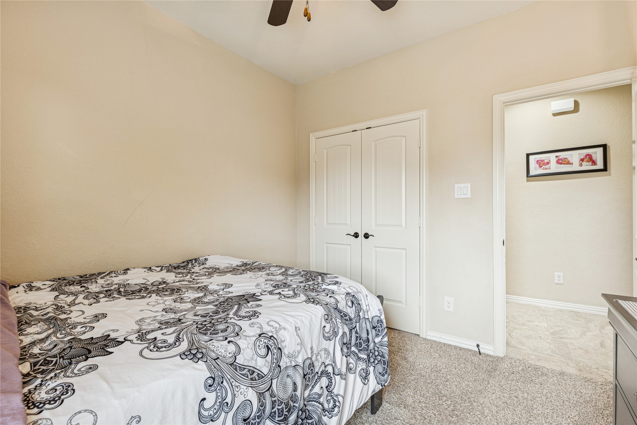 3876 Oakmist Bend Lane Spring, TX 77386 - Photo 32 of 41 a bedroom with a bed and a painting on the wall
