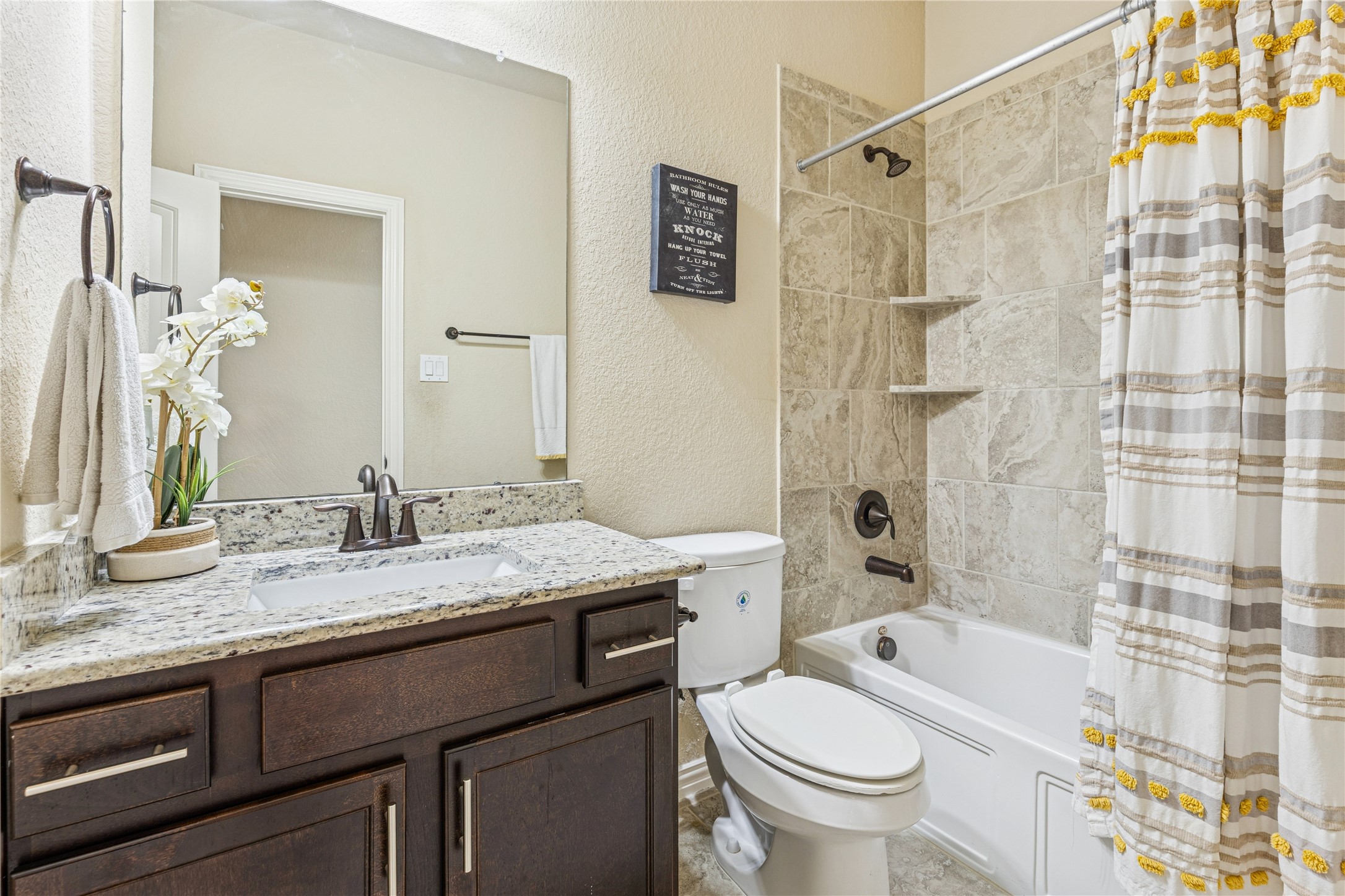 3876 Oakmist Bend Lane Spring, TX 77386 - Photo 33 of 41 a bathroom with a granite countertop sink toilet and shower