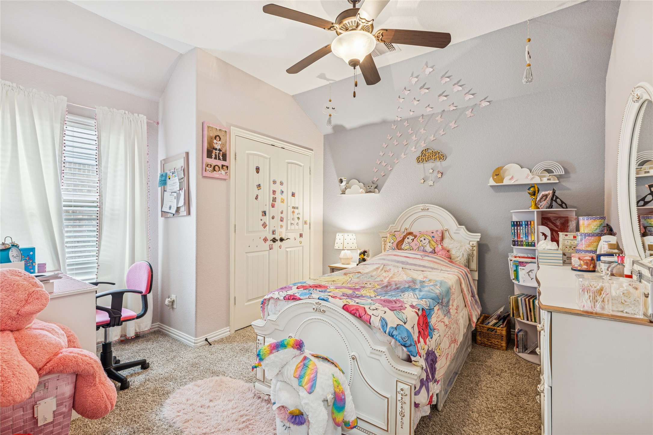 3876 Oakmist Bend Lane Spring, TX 77386 - Photo 34 of 41 a bedroom with a bed and a chandelier