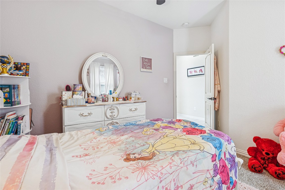 3876 Oakmist Bend Lane Spring, TX 77386 - Photo 35 of 41 a bedroom with a bed and a dresser