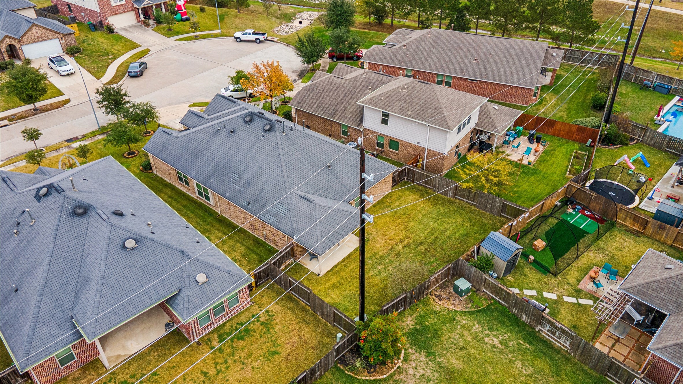 3876 Oakmist Bend Lane Spring, TX 77386 - Photo 41 of 41 an aerial view of a house with swimming pool and outdoor seating