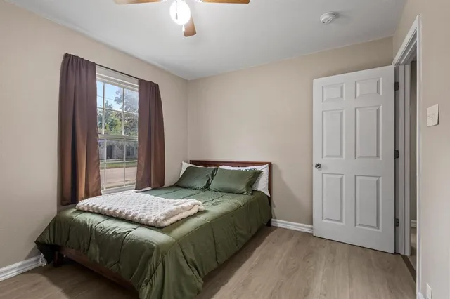 a bedroom with a bed and a window