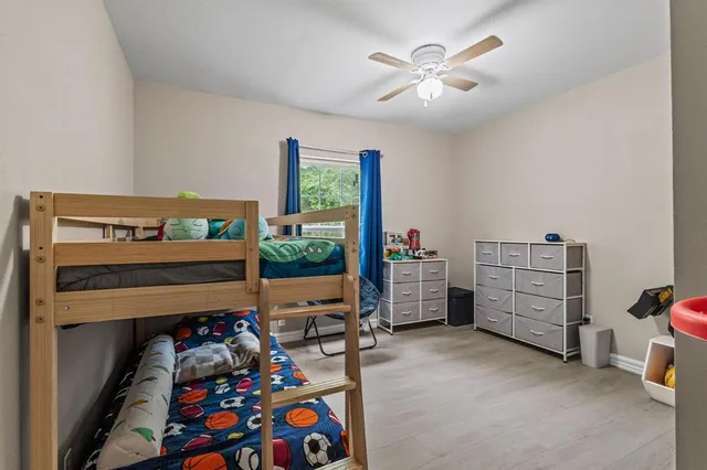 a room with furniture and a baby crib