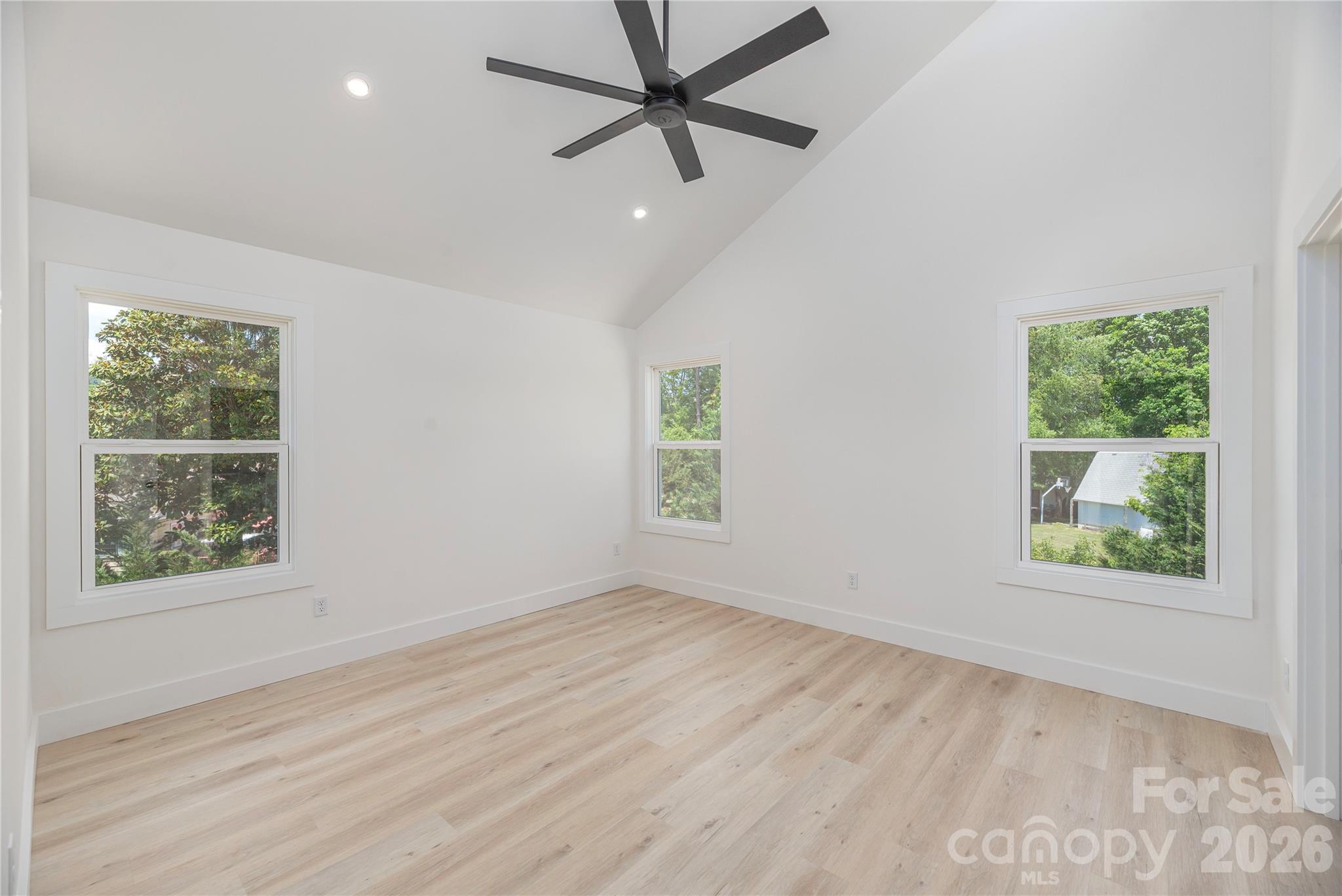 32 Oak Hill Road Candler, NC 28715 - Photo 15 of 29 an empty room with a window and a fan