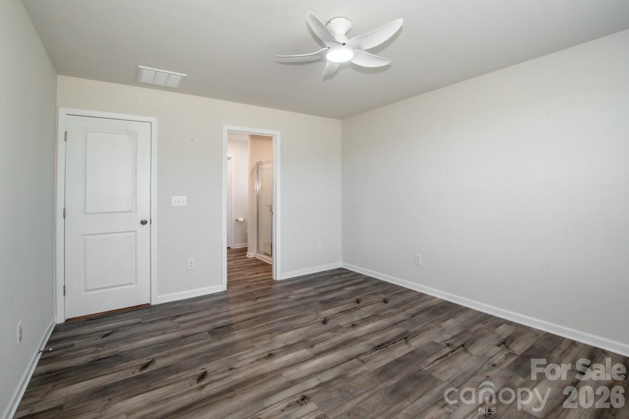 2742 Legacy Ridge Lane Catawba, NC 28609 - Photo 24 of 36 a view of an empty room with wooden floor