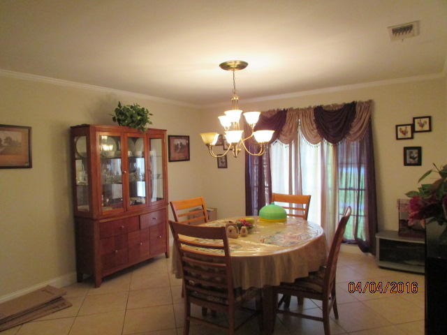 8720 Hidden Pines Road Fort Pierce, FL 34945 - Photo 4 of 31 4 dining room