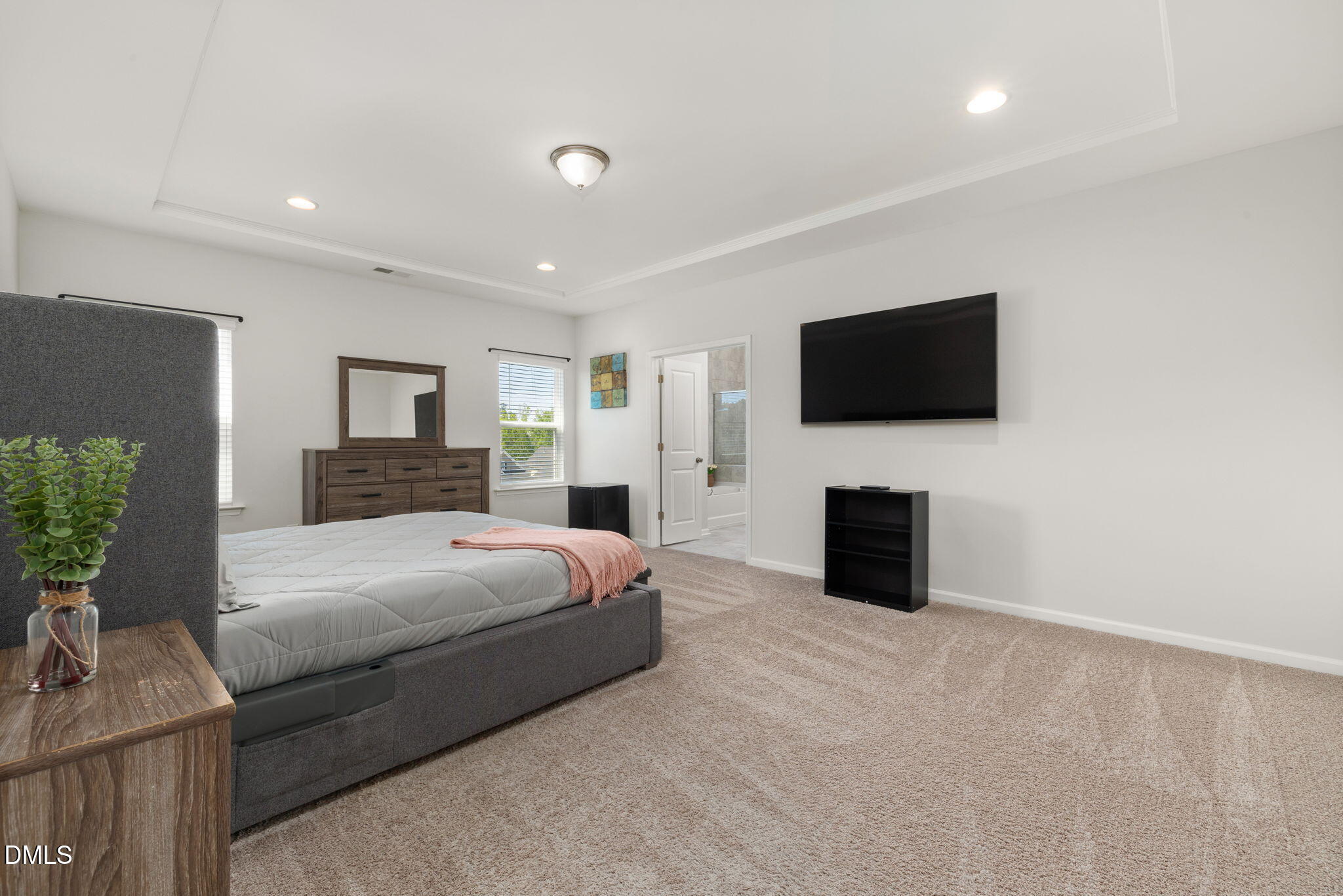 3422 Longleaf Estates Drive Raleigh, NC 27616 - Photo 31 of 71 a bedroom with a bed and a flat screen tv