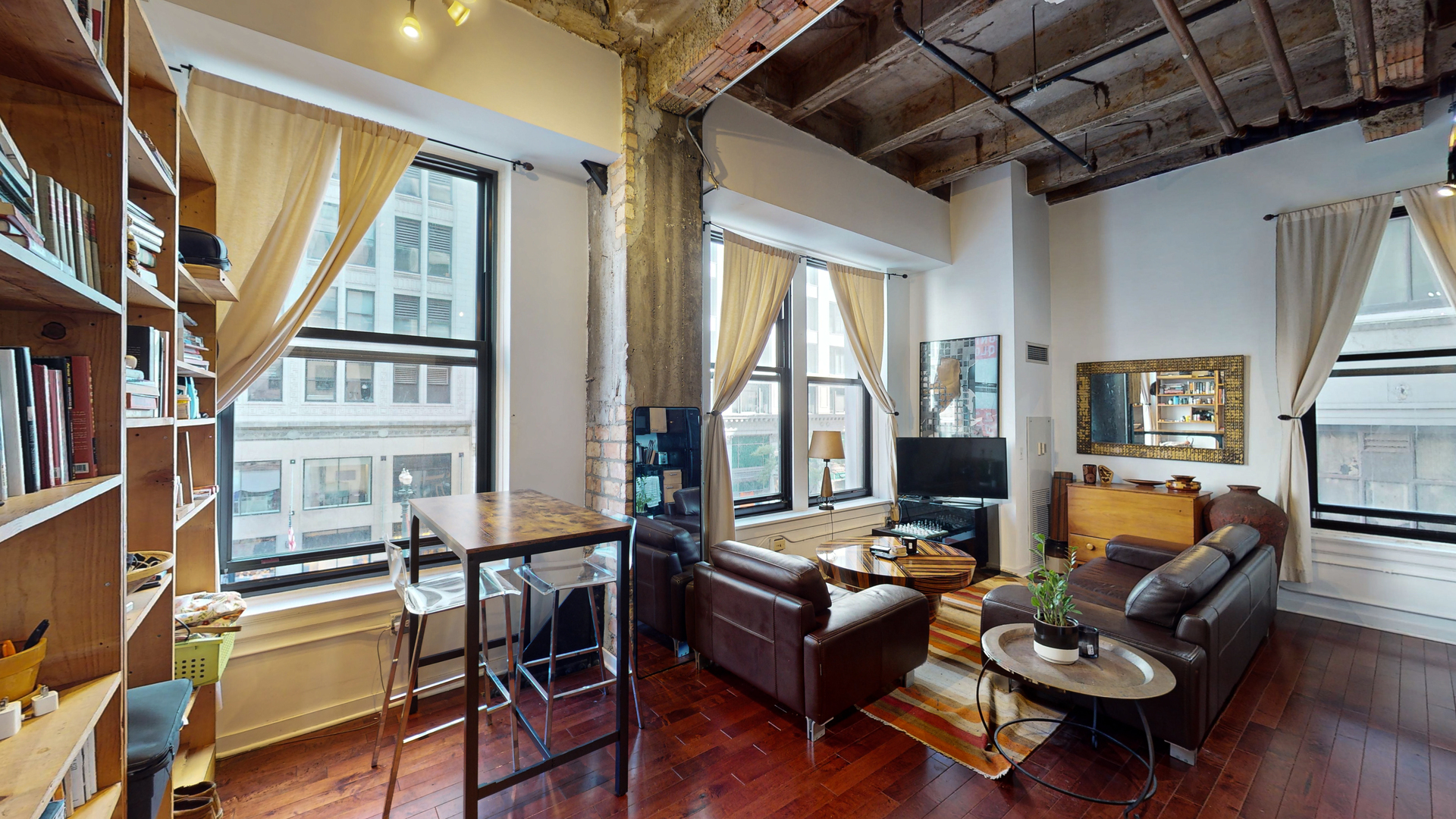 20 North State Street, Unit 307 Chicago, IL 60602 - Photo 2 of 7 a living room with furniture and a large window