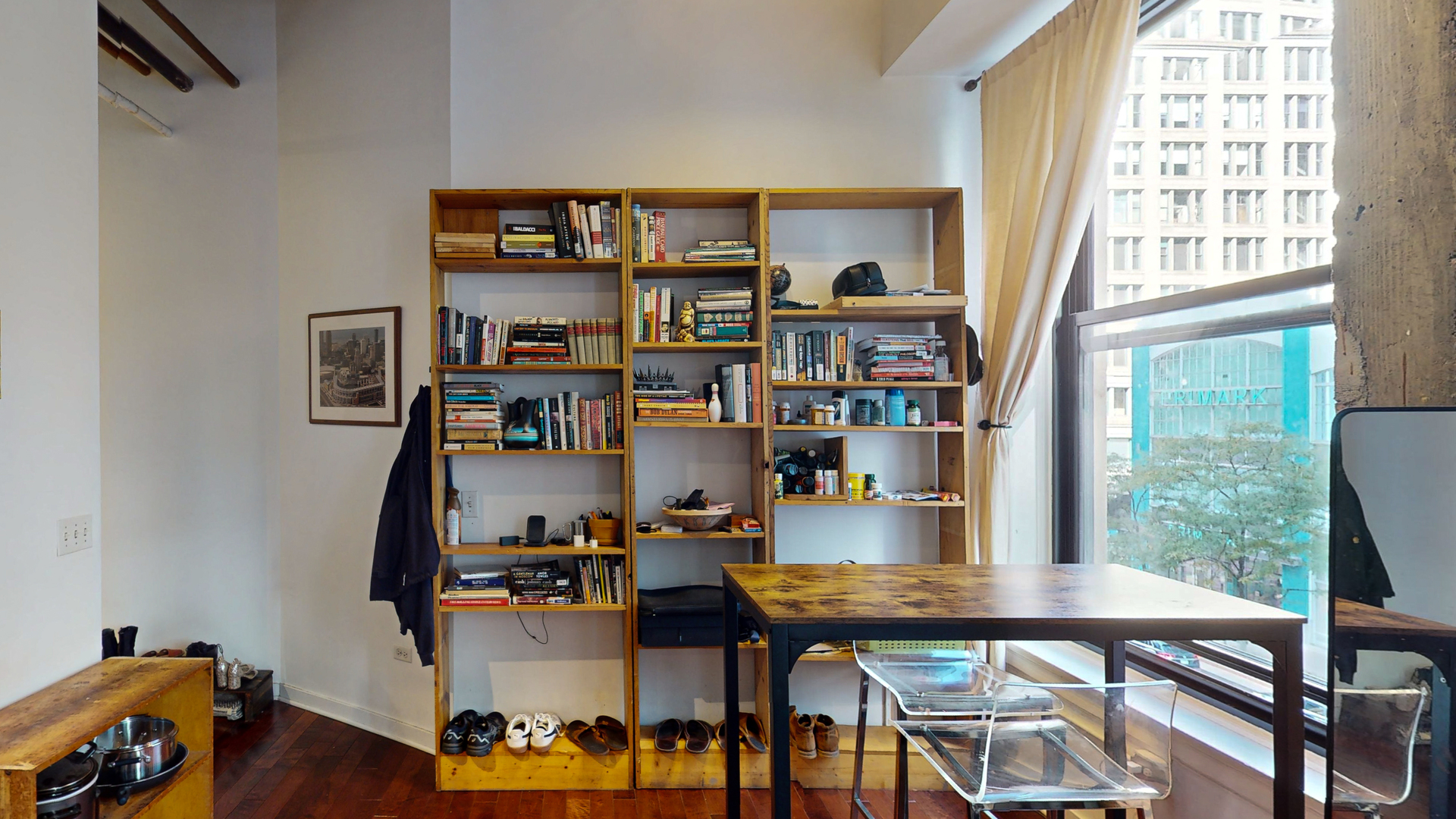 20 North State Street, Unit 307 Chicago, IL 60602 - Photo 4 of 7 a view of a workspace with furniture and a book shelf
