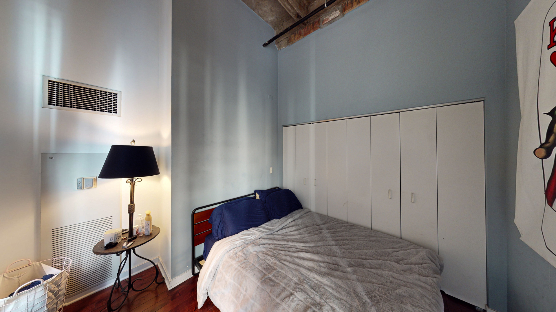 20 North State Street, Unit 307 Chicago, IL 60602 - Photo 6 of 7 a bedroom with a bed and a flat tv screen on a dresser